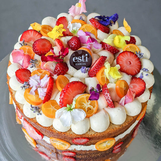 Spring Lemon Drizzle Cake With Fruits and Flowers on top by Esti Garcia Sydney